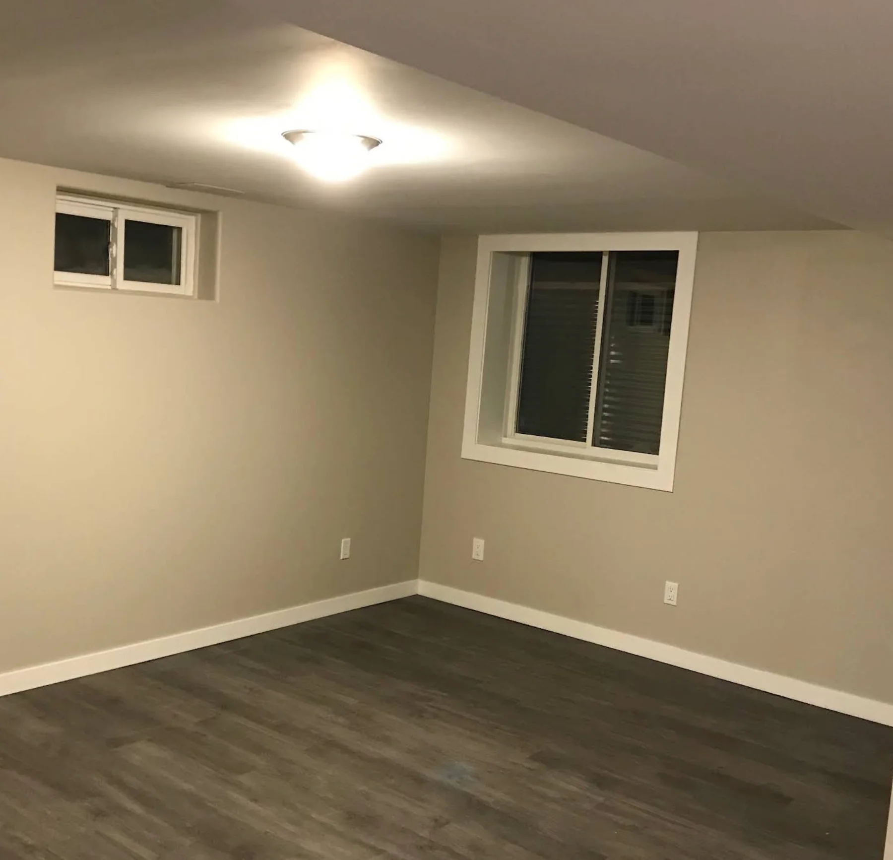 Finished basement with lighting and outlets — supplied Baker Electric photo